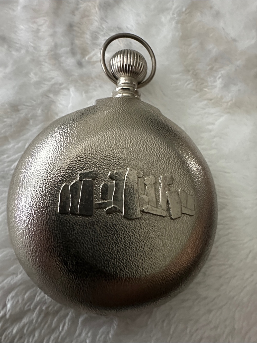 Silver toned Metallic pocket Stonehenge sun dial.